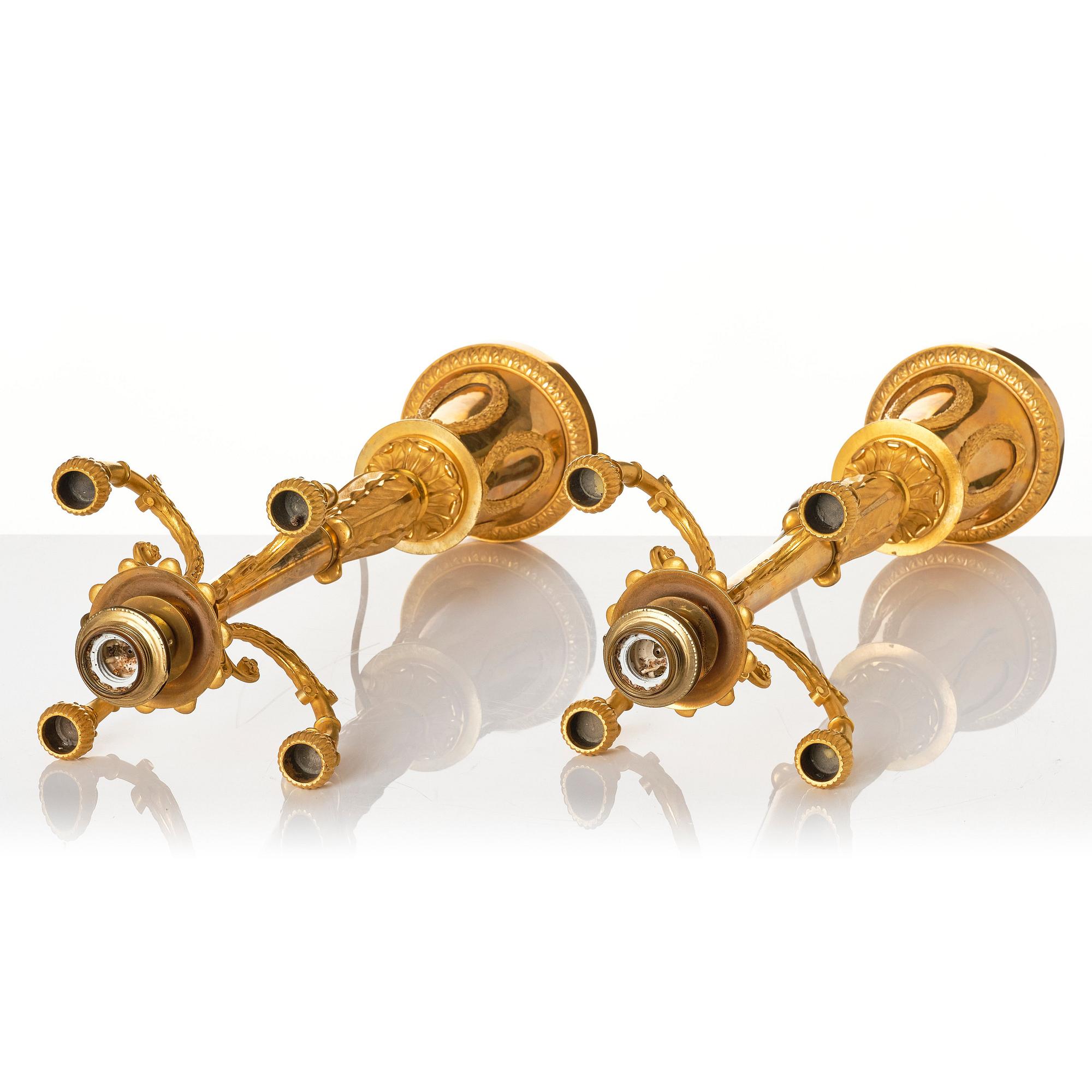 A pair of French Empire four-light candelabra (lamps), early 19th century.