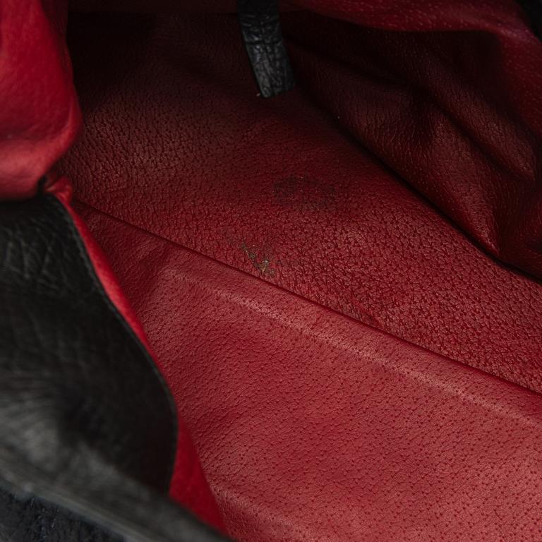 Max Mara, a leather handbag.