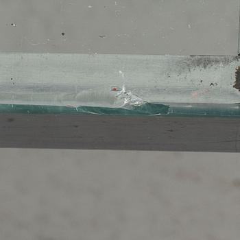 A TOBIA SCARPA GLASS TOP SOFA TABLE.