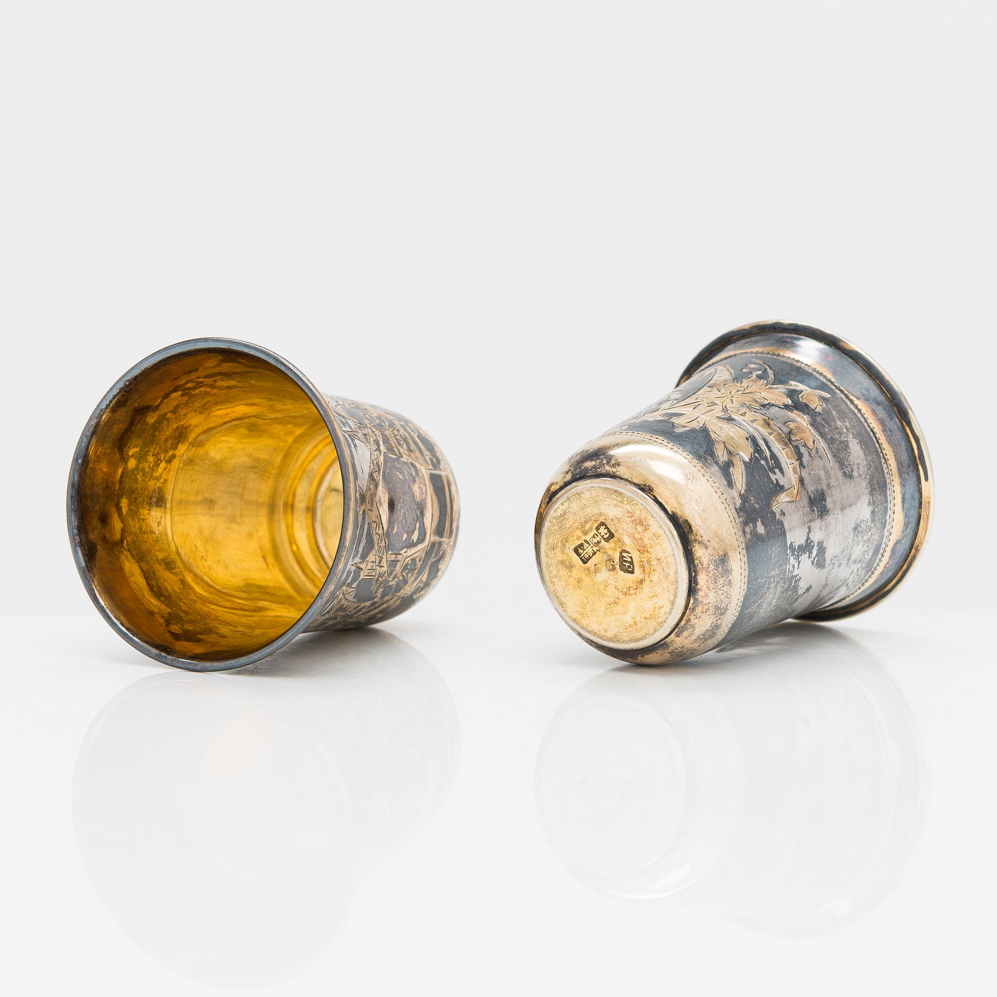 Four parcel-gilt silver beakers, Moscow 1870, 1876 and 1890.