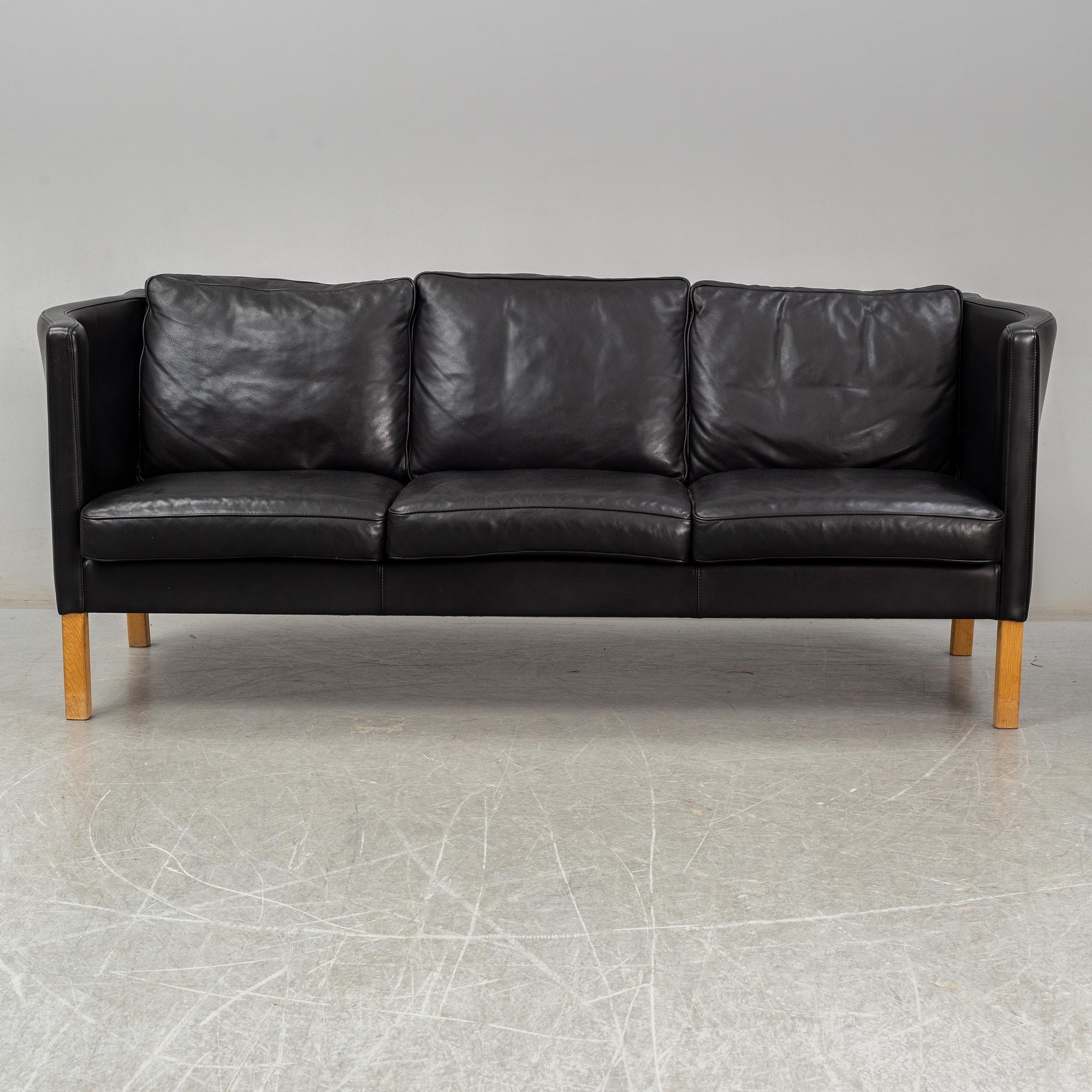 An 'AV59' sofa by Arne Vodder, Nielaus, Denmark.