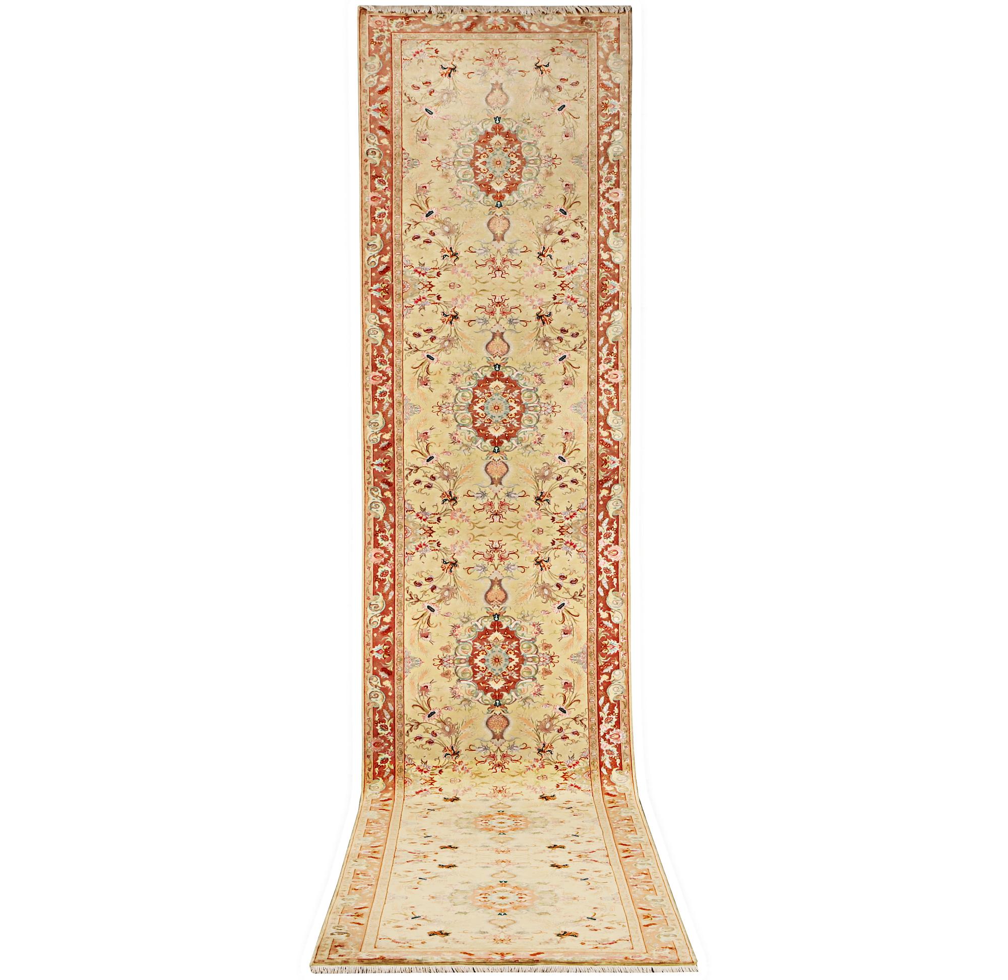 A Tabriz carpet, part silk, 50 raj, a. 508 x 85 cm.
