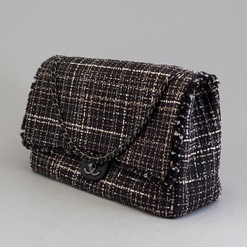 A tweed bag "Classic flip bag XL" by Chanel from 2016-2017.