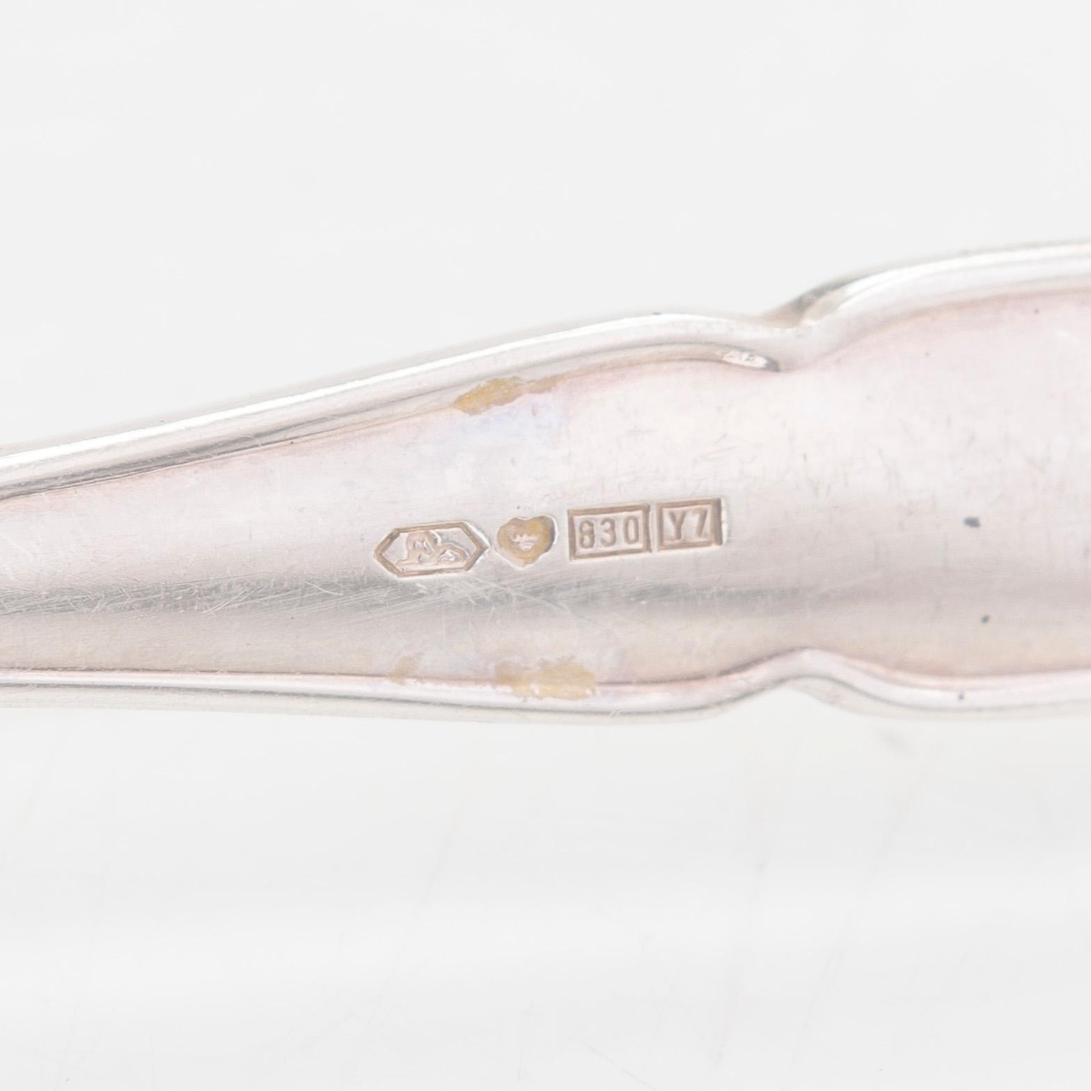 A 78-piece silver 'Chippendale' cutlery set, 1978-2007. Various Finnish manufacturers.