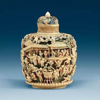A deeply carved ivory snuff bottle with cover, China, early 20th Century.