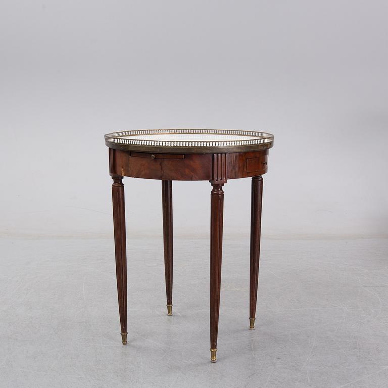 A Louis XVI style marble top mahognay table, circa 1900.