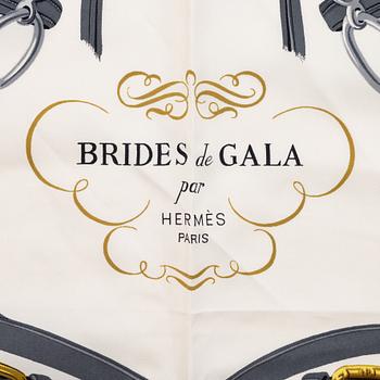 Hermès, a 'Brides de Gala' silk scarf.