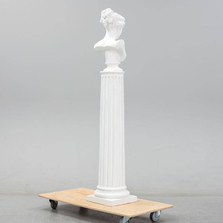 A plaster bust and pedestal.