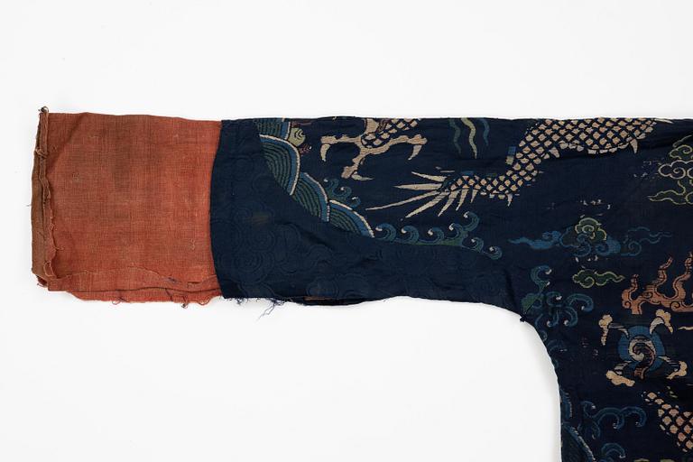 A rare fragment of a silk four clawed 'dragon' jacket, late Ming dynasty/early Qing dynasty.