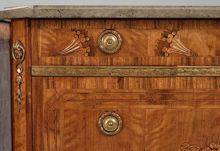 A matched pair of Gustavian ormolu-mounted limestone topped and marquetry commodes by C. Lindborg, late 18th century.