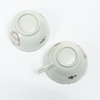 Cups and saucers, 11+7, and a teapot in famille rose with monogram, company porcelain, China, 18th century.