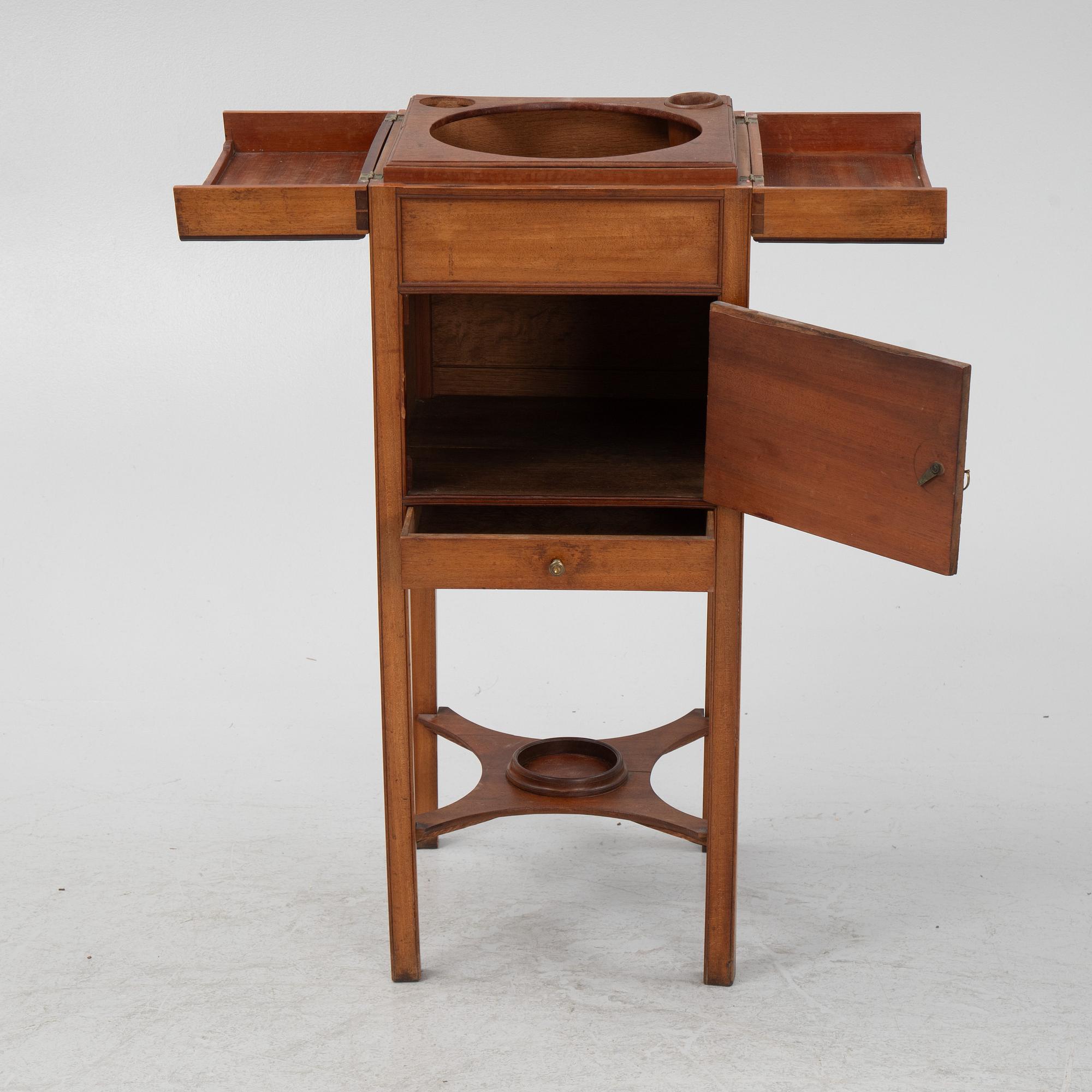 A mahogany shaving stand, 19th Century.
