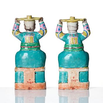 A pair of famille rose candlesticks, Qing dynasty, Qianlong (1736-95).