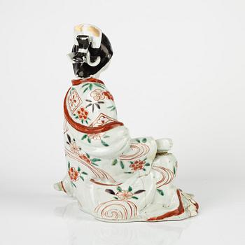 A Japanese porcelain figure, 18th century.