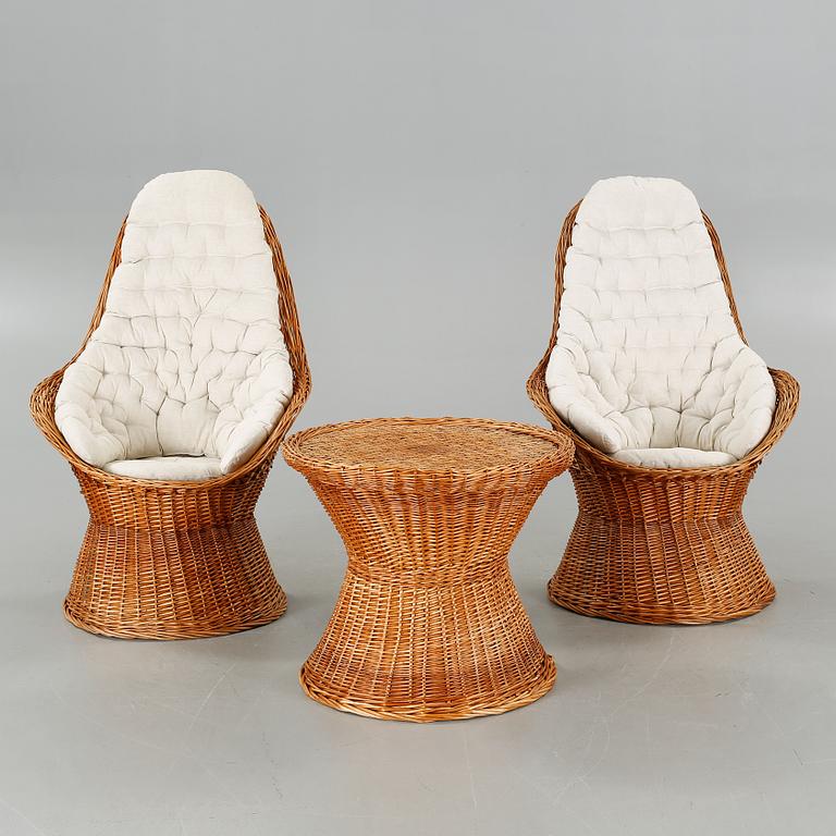 A pair of chairs and one table from the latter half of the 20th century.