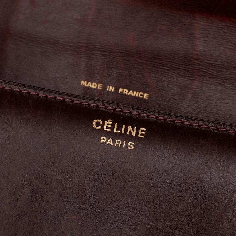 CÉLINE, a red leather shoulder bag.