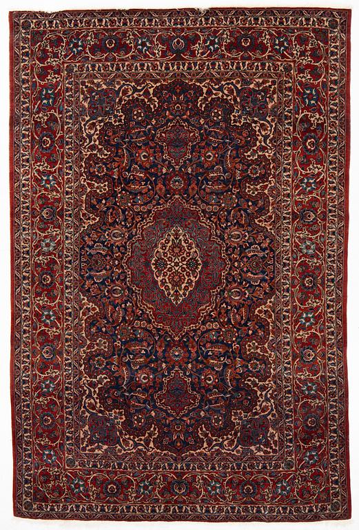 A semi-antique Isfahan rug, central Persia, c. 305 x 205 cm.