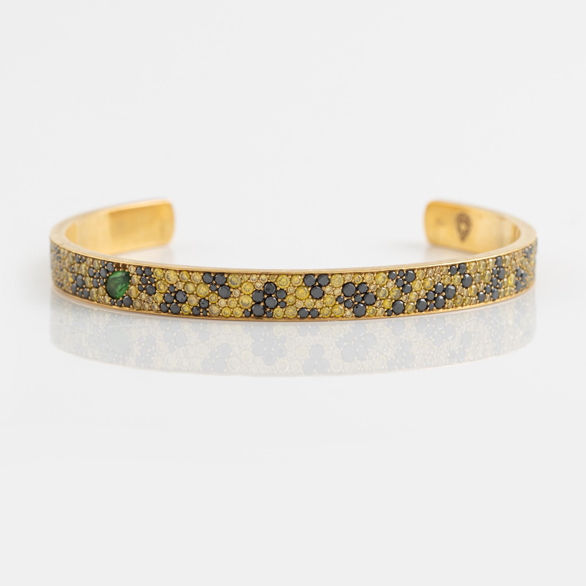 Crow's nest jewels, gold, black and yellow diamond and pear shaped tsavorite bangle.