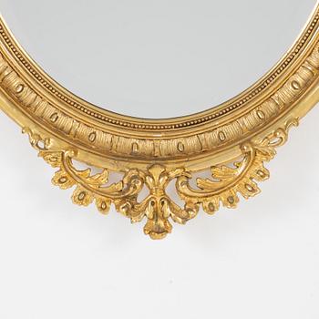 A Rococo style mirror, first half of the 20th Century.