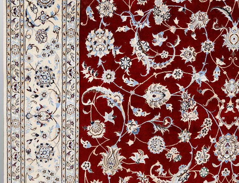A Nain part silk carpet, 302 x 204 cm.