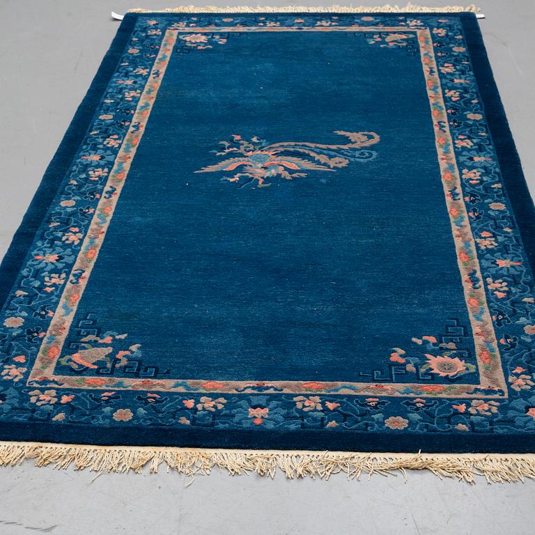 A CARPET, an old China, ca 295 x 153 cm (as well as 2 cm flat weave at the ends).