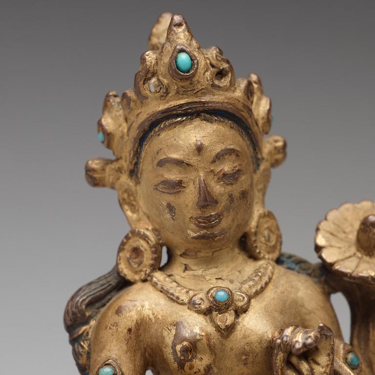 A Tibetan gilt copper alloy figure of Tara, 18th Century or older.