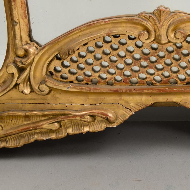 A late 19th century mirror in rococo style.