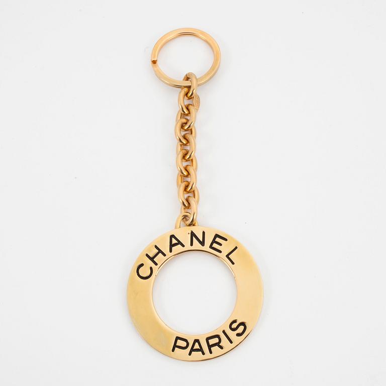 CHANEL, a golden key-ring.
