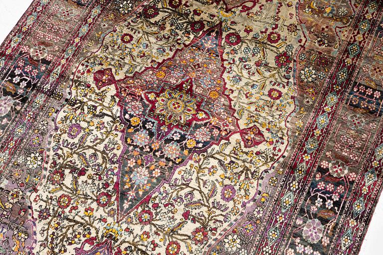 An antique silk Kashan rug, Central Persia, c. 207 x 131 cm.