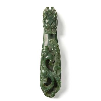 1197. A nephrite belt hook, China, early 20th Century or older.