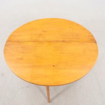 A birch folding table later part of the 19th century.