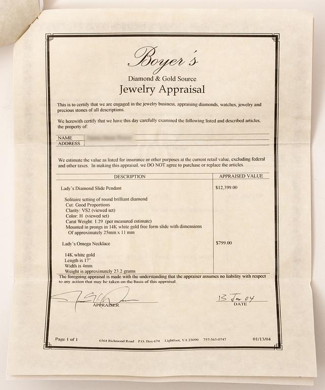 14K white gold solitaire diamond pendant.