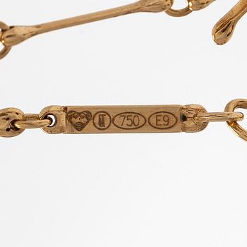 Kirsti Doukas, halsband, "Pohjantähti", 18K guld och granater, Kalevala Koru, Helsingfors 2006. Numrerad 86/200.