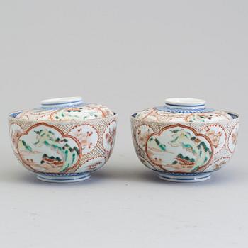 A pair of Japanese early 20th century porcelain bowls with covers.