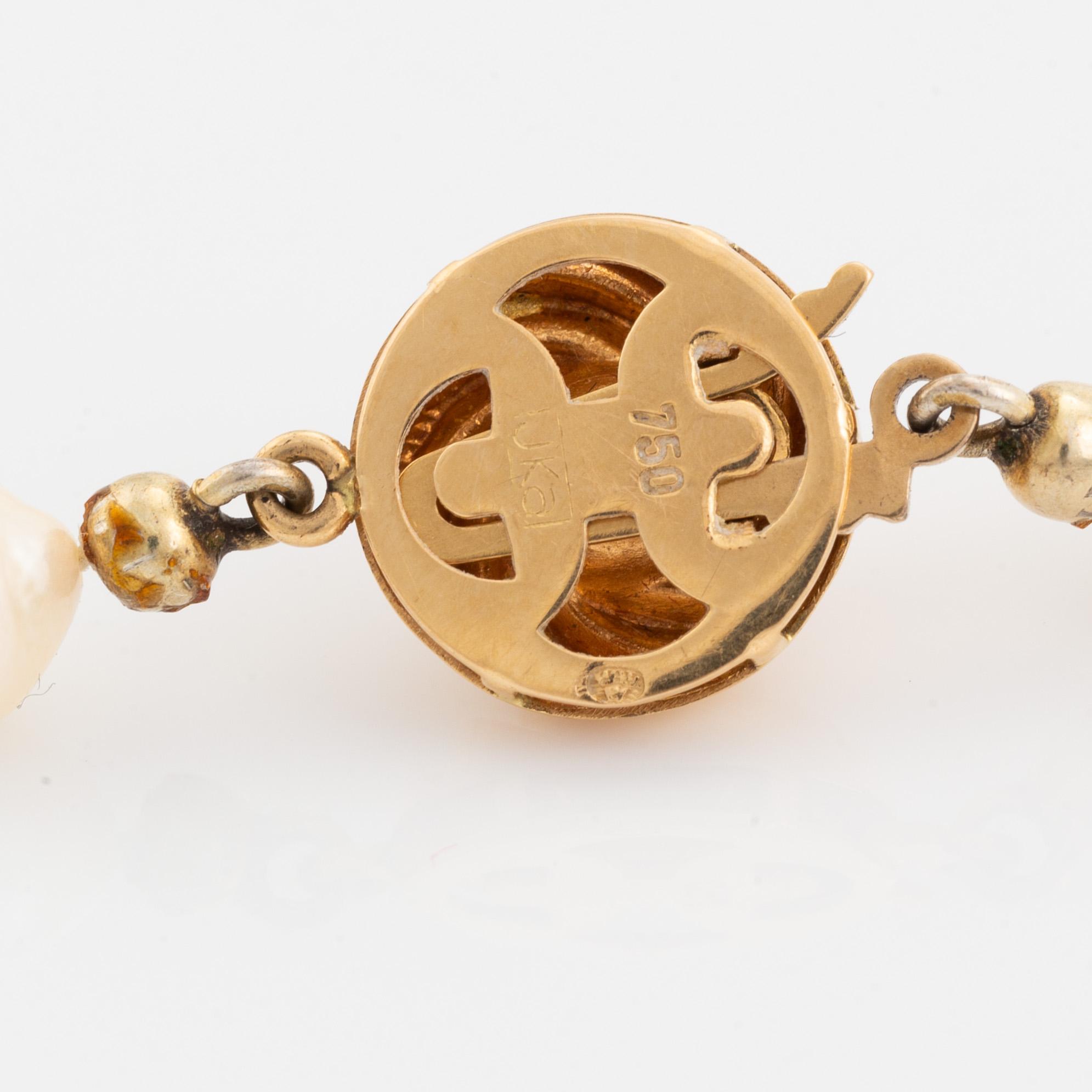 Cultured pearl necklace, with heart shaped charm.