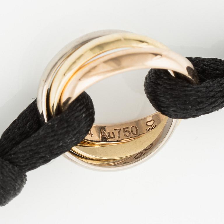 A Cartier "Trinity" bracelet, 18K three colour gold and textile.