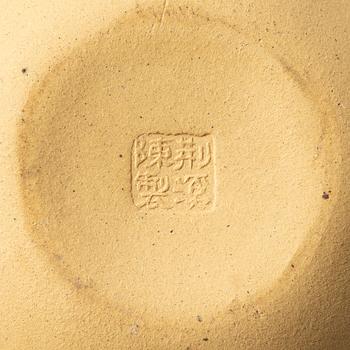 A group of three yixing teapots and a box with cover, China, 1970/80s.