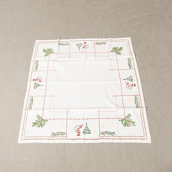 A collection of Christmas tablecloths 12 pcs first half/mid 20th century.