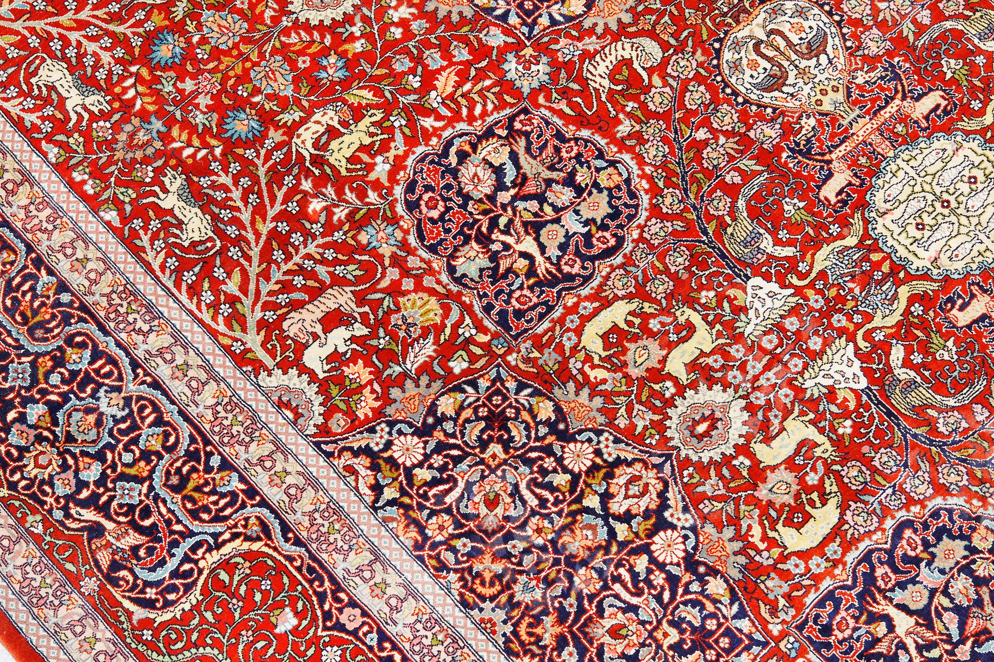 A pictoral orietal silk rug, 246 x 153 cm.