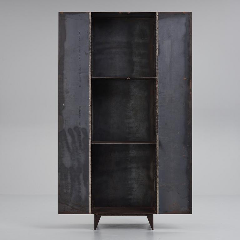 A contemporary patinated metal cabinet.