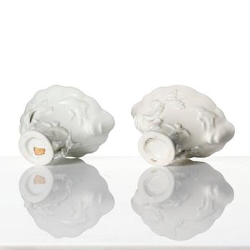 A pair of blanc de chine rhinoceros libation cups, Qing dynasty, Kangxi (1662-1722).