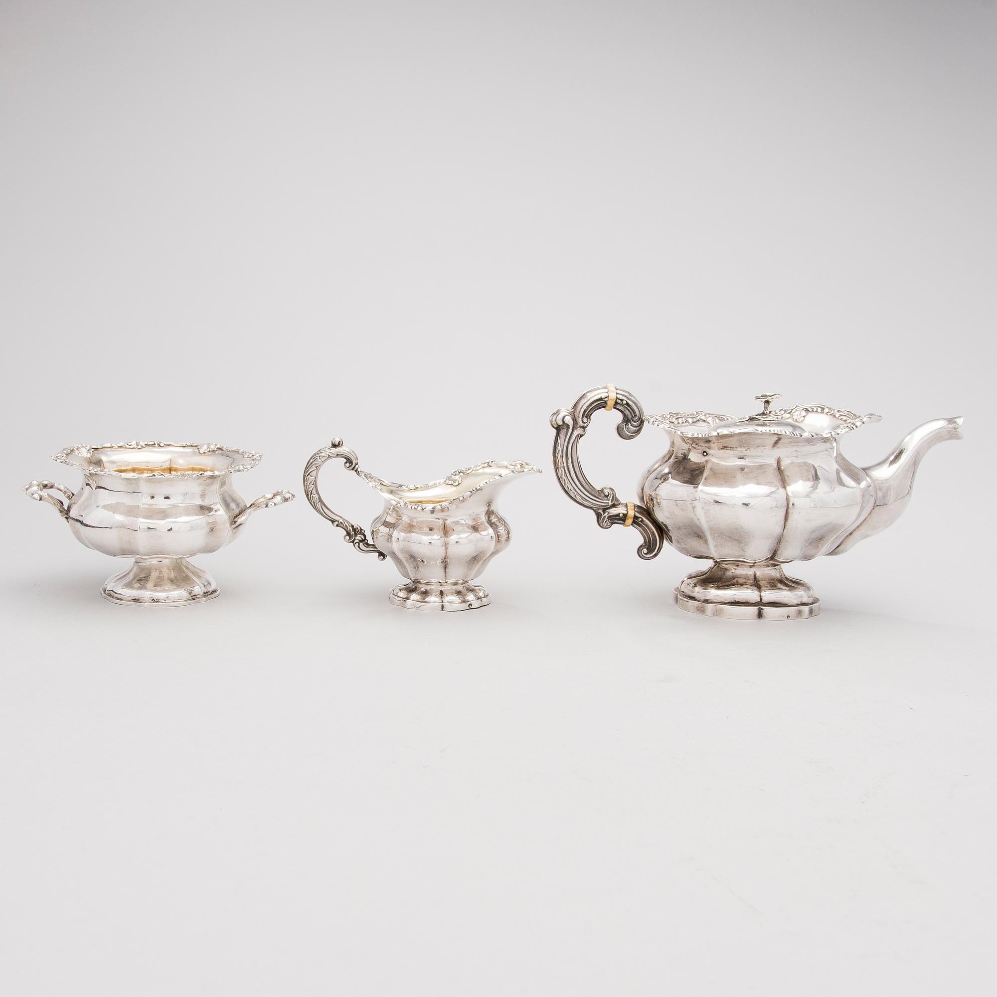 A three-piece Russian tea set, silver, St. Petersburg, Mid 19th Century.