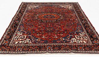 A semi-antique Abadeh carpet, approximately 296 x 191-196 cm.