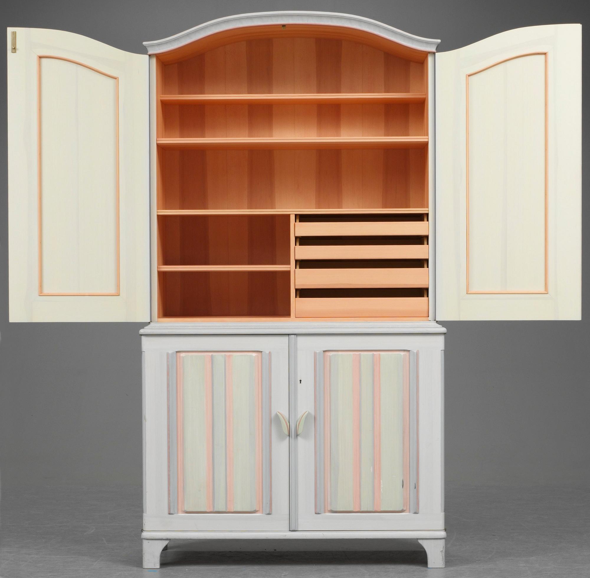 A Carl Malmsten cabinet, "Stigberget", with carved and painted decoration of flowers in colours.