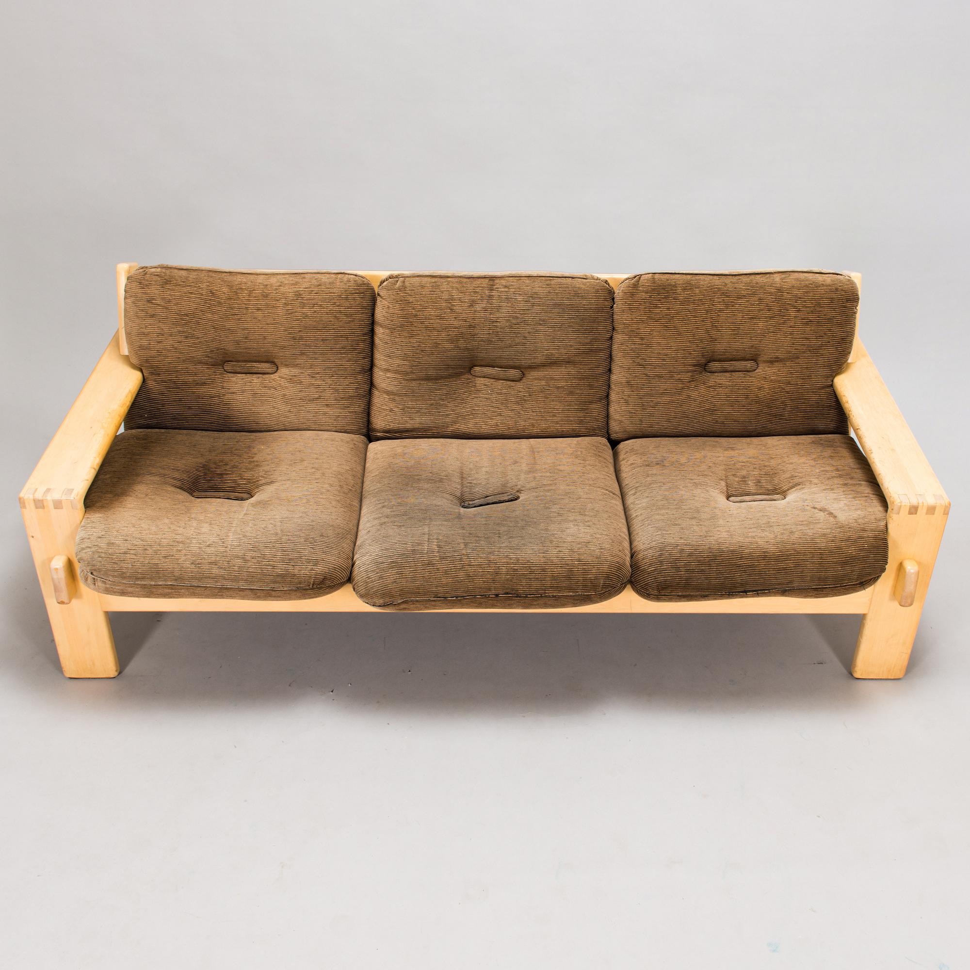 Esko Pajamies, A pair of 1970's 'Bonanza' armchairs, coffee table and sofa for Asko.