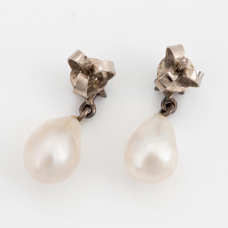 Drop shaped pear and rose-cut diamond earrings.