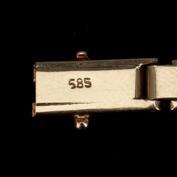 DAMARMBANDSUR, 18k guld samt briljantslipade diamanter tot. ca 0,38 ct. Patek Philippe, Genève.