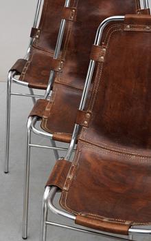 A set of four Charlotte Perriand 'Les Arcs' chairs, tubular chromium plated steel frame with brown leather sling seat,