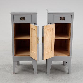 A pair of painted bedside tables stands. First half of the 20th century.