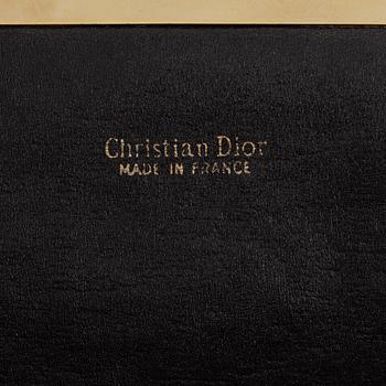 Christian Dior, a canvas clutch.